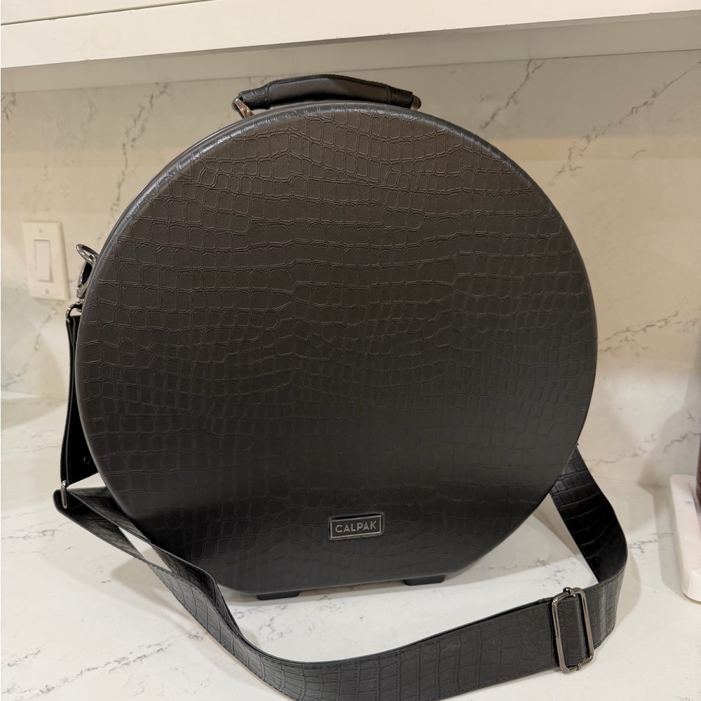 Calpak Black Croc-Embossed Round Travel Case with Strap